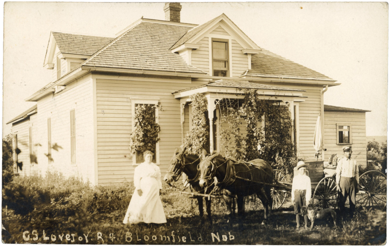 R.F.D. Route 4 mail wagon at a farmhouse, Bloomfield, Nebraska — “C.S. Lovejoy. R 4. Bloomfield Neb” in the negative